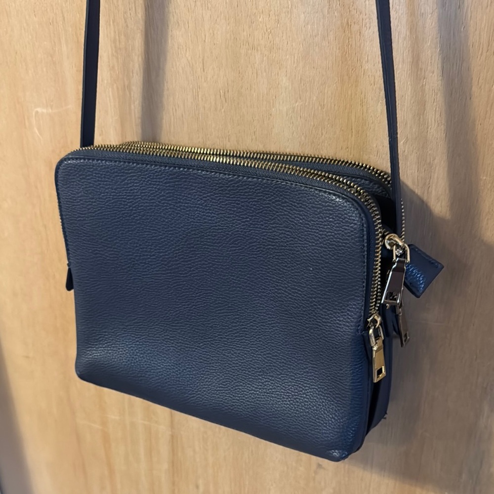Like new Navy Leather Crossbody Bag with Gold Accents